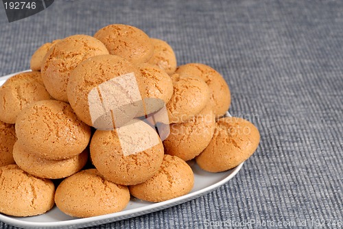 Image of Plate of Italian Amaretti cookies on a blue placemat