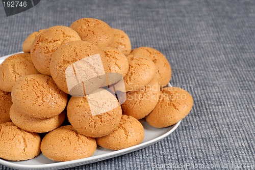 Image of Plate of Italian Amaretti cookies on a blue placemat