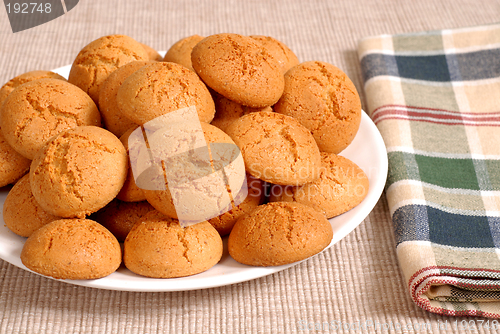 Image of Plate of crisp Italian Amaretti cookies with a checkered napkin