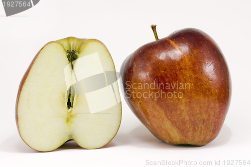 Image of A ripe red apple and half apple