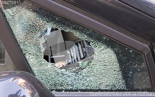 Image of forced car windscreen and broken