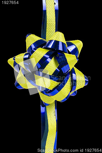 Image of flower ornament,  yellow and blue