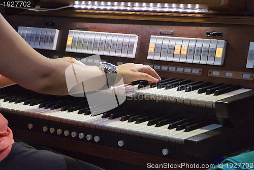 Image of playing piano organ