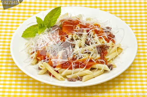 Image of Traditional macaroni pasta with tomato grated cheese