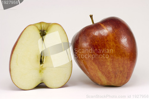 Image of A ripe red apple and half apple