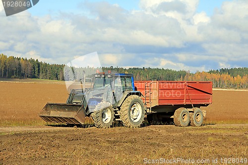 Image of Tractor and Agricultural Trailer on Flax Field