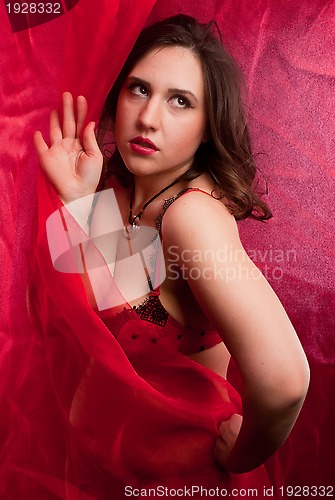 Image of young woman in red lingerie