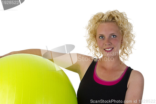 Image of Beautiful young woman with gym ball