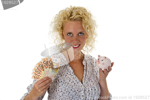 Image of Young woman with piggy bank and euro banknotes