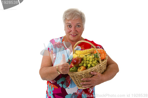 Image of Female senior holding fruit basket