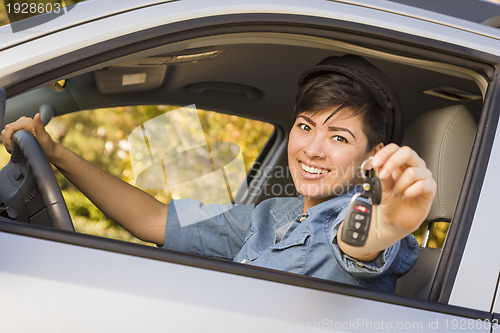 Image of Happy Mixed Race Woman in Car Holding Keys