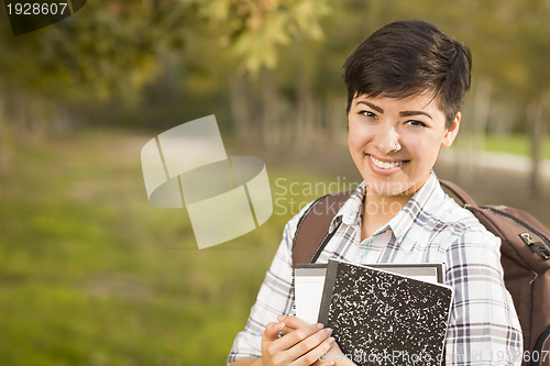 Image of Portrait of a Pretty Mixed Race Female Student Holding Books