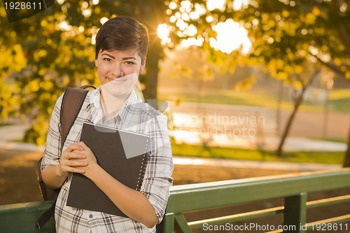 Image of Portrait of a Pretty Mixed Race Female Student Holding Books