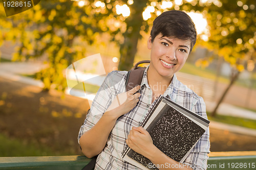 Image of Portrait of a Pretty Mixed Race Female Student Holding Books