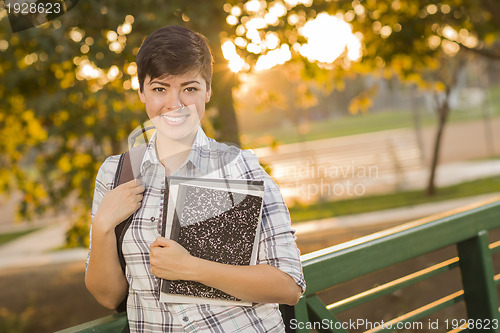Image of Portrait of a Pretty Mixed Race Female Student Holding Books