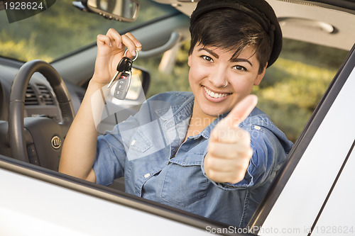 Image of Happy Mixed Race Woman in Car Holding Keys