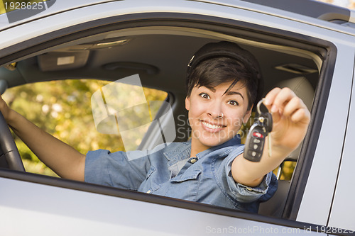 Image of Happy Mixed Race Woman in Car Holding Keys