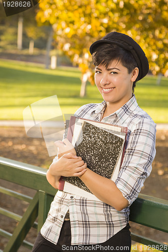 Image of Portrait of a Pretty Mixed Race Female Student Holding Books