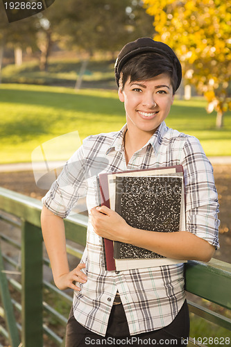 Image of Portrait of a Pretty Mixed Race Female Student Holding Books