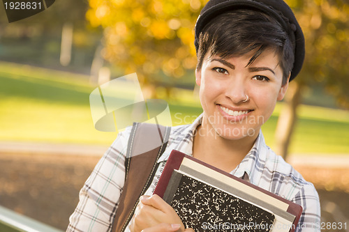 Image of Portrait of a Pretty Mixed Race Female Student Holding Books