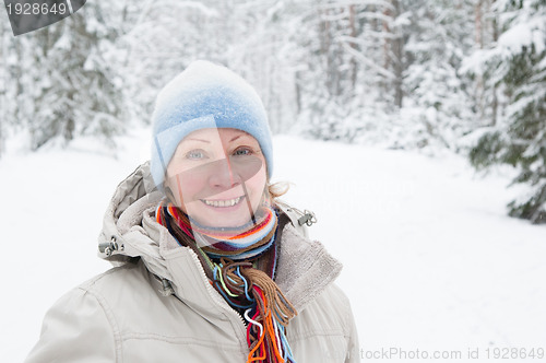 Image of Portrait of a middle-aged woman in winter in the forest