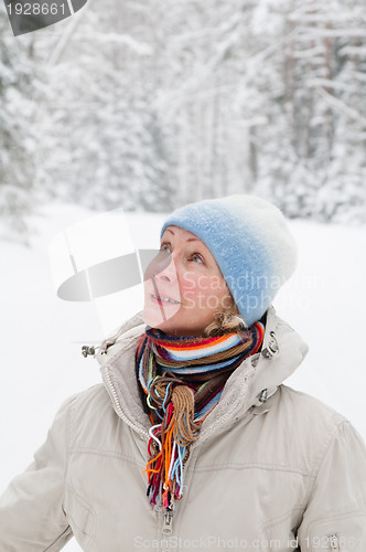 Image of Portrait of a middle-aged woman in winter in the forest