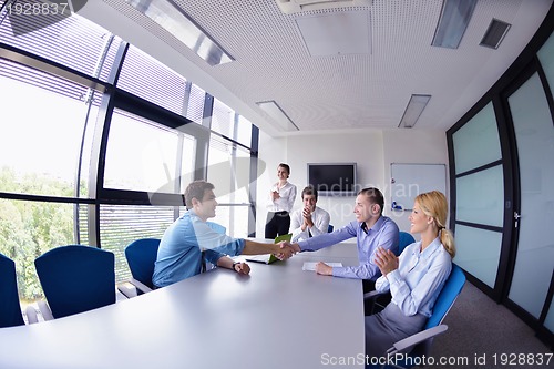 Image of business people making deal