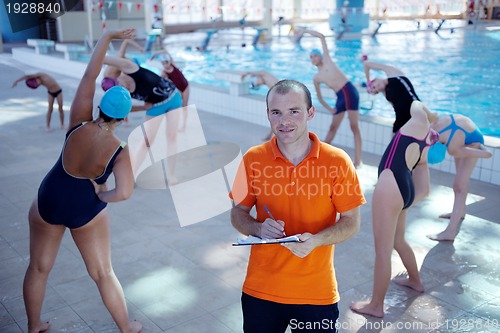 Image of happy children group  at swimming pool