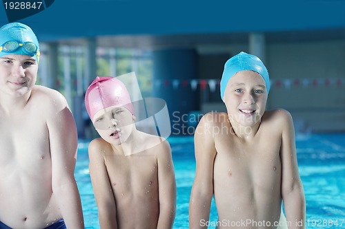 Image of happy children group  at swimming pool