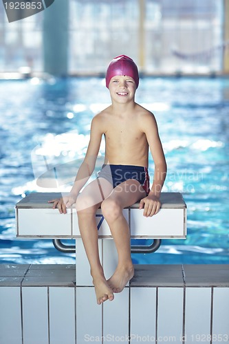 Image of happy child on swimming pool