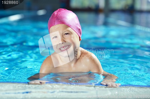 Image of happy child on swimming pool