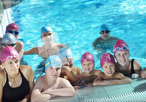 Image of happy children group  at swimming pool