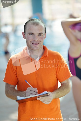 Image of happy children group  at swimming pool