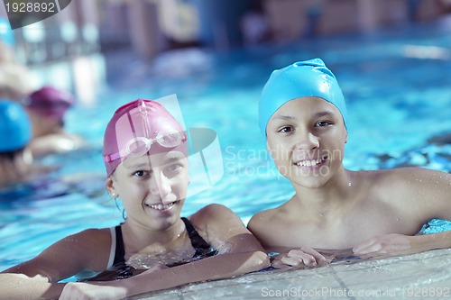 Image of happy children group  at swimming pool