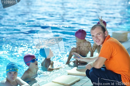 Image of happy children group  at swimming pool