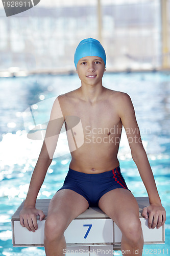 Image of happy child on swimming pool