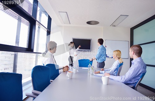 Image of business people in a meeting at office
