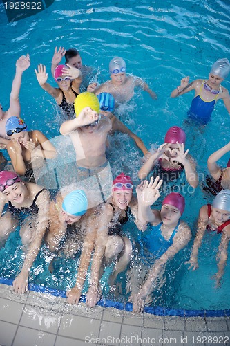 Image of happy children group  at swimming pool