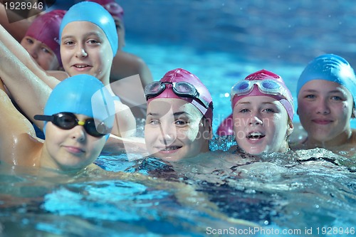Image of happy children group  at swimming pool