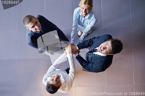 Image of business people group joining hands