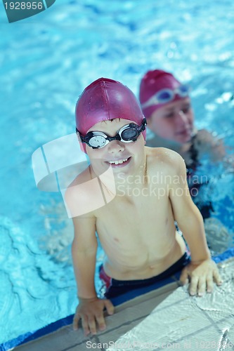 Image of happy children group  at swimming pool