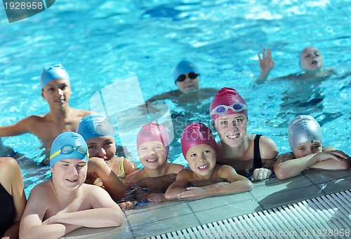 Image of happy children group  at swimming pool