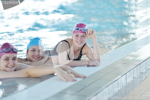 Image of happy children group  at swimming pool