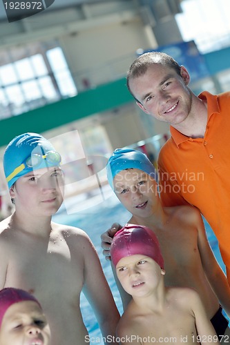 Image of happy children group  at swimming pool