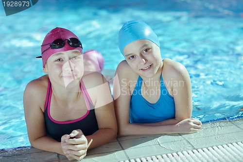 Image of happy children group  at swimming pool