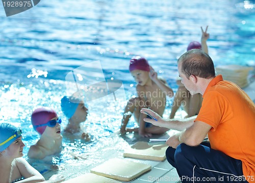 Image of happy children group  at swimming pool