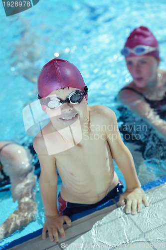 Image of happy children group  at swimming pool