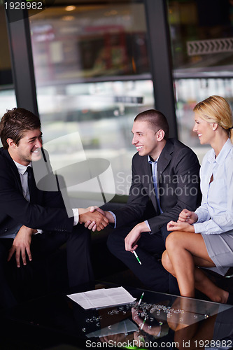 Image of business people making deal