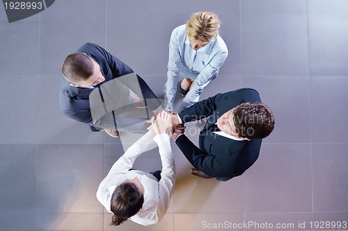 Image of business people group joining hands