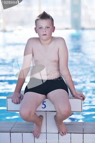 Image of happy child on swimming pool